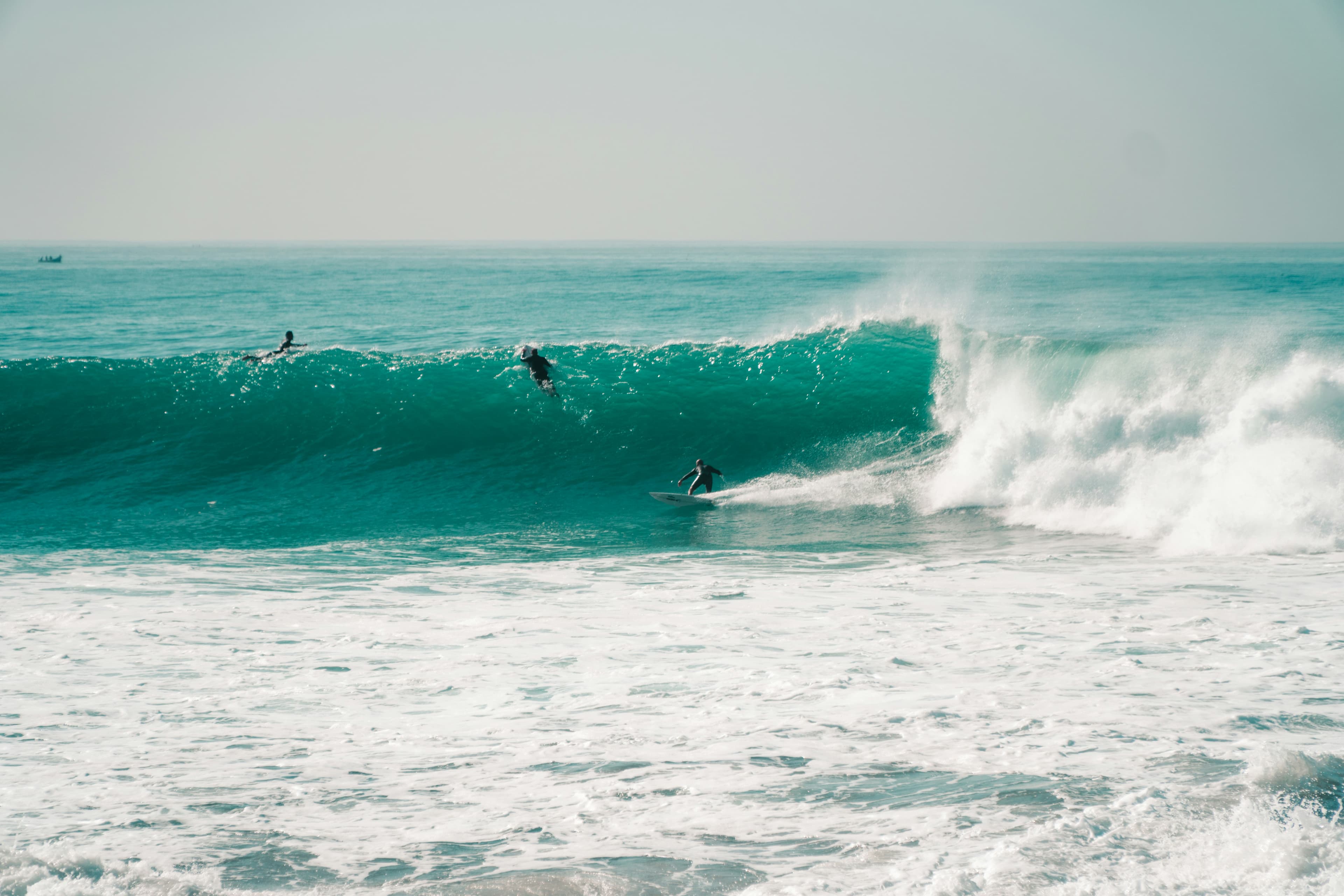Surfer riding inside a clean turquoise wave