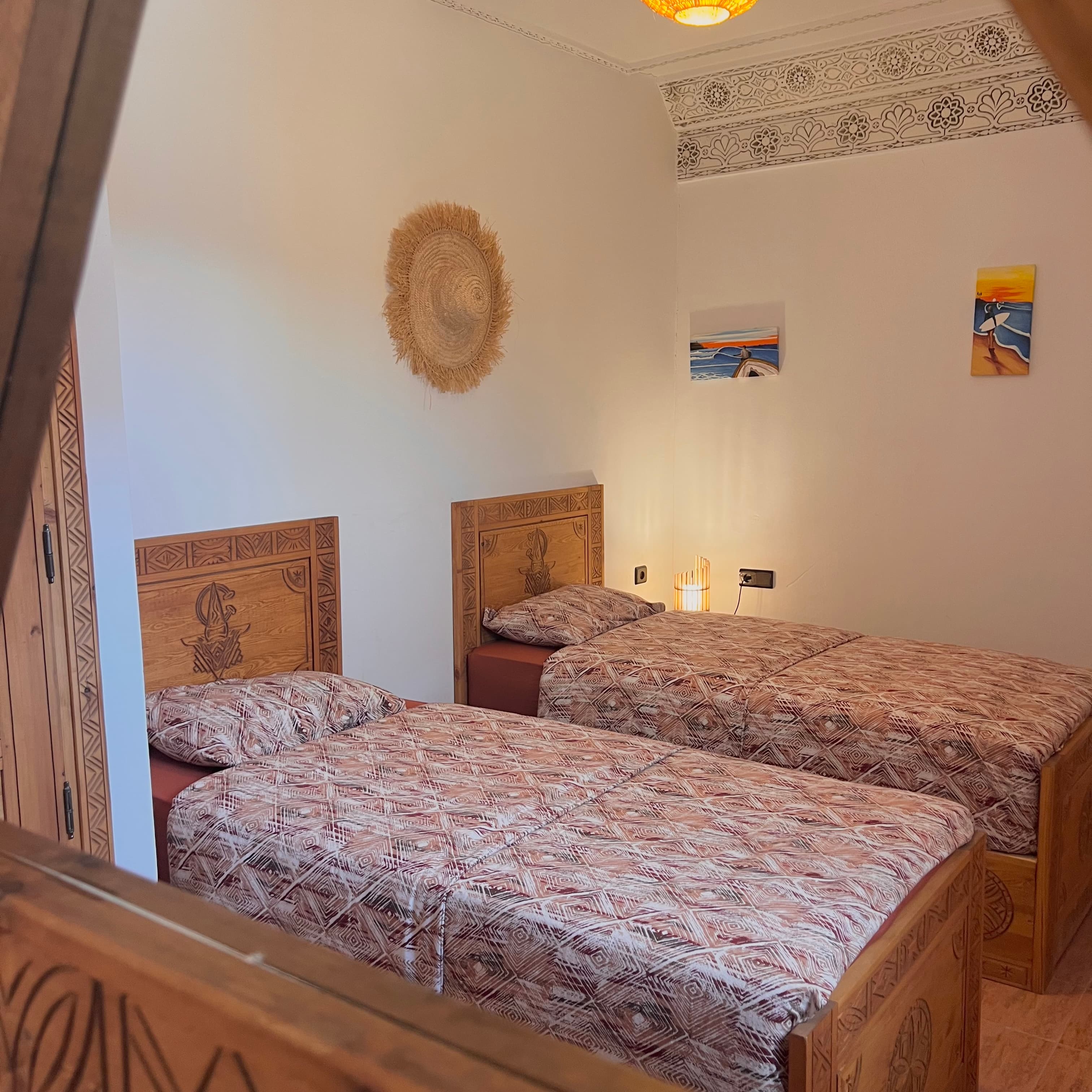 Sunset Surf House cozy private master bedroom with authentic textiles