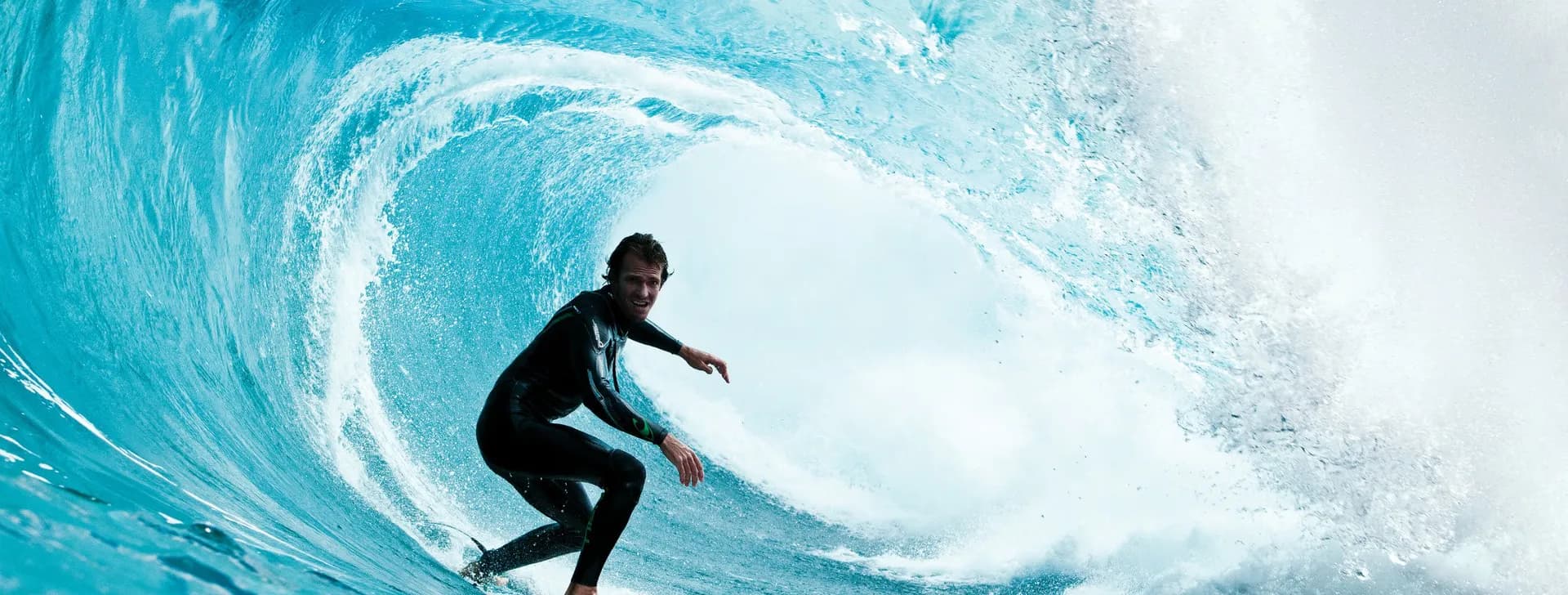 A surfer dropping into the barrel of a large wave on the Moroccan coast